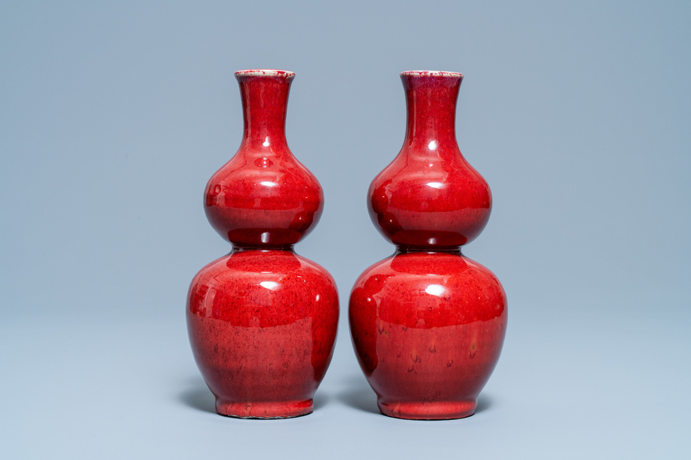 A pair of Chinese sang de boeuf-glazed double gourd vases, 19th C.