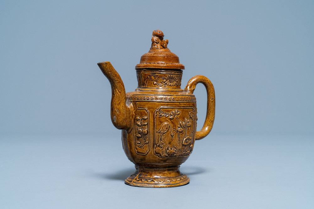 A Chinese brown-glazed relief-decorated teapot and cover, 18/19th