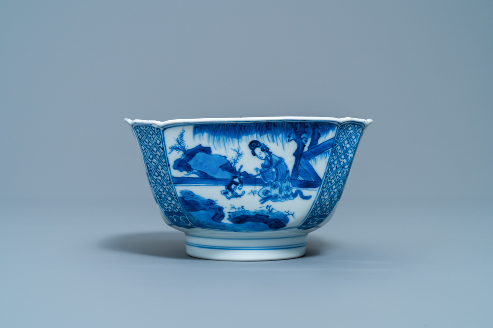 A Chinese blue and white bowl with a lady with cat, Kangxi mark and of the period