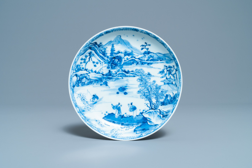 A Chinese blue and white plate with figures in a landscape, Yonzheng