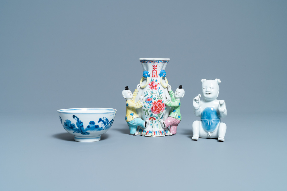 A Chinese blue and white bowl, a figure of a boy and a famille rose wall vase, Kangxi/Qianlong