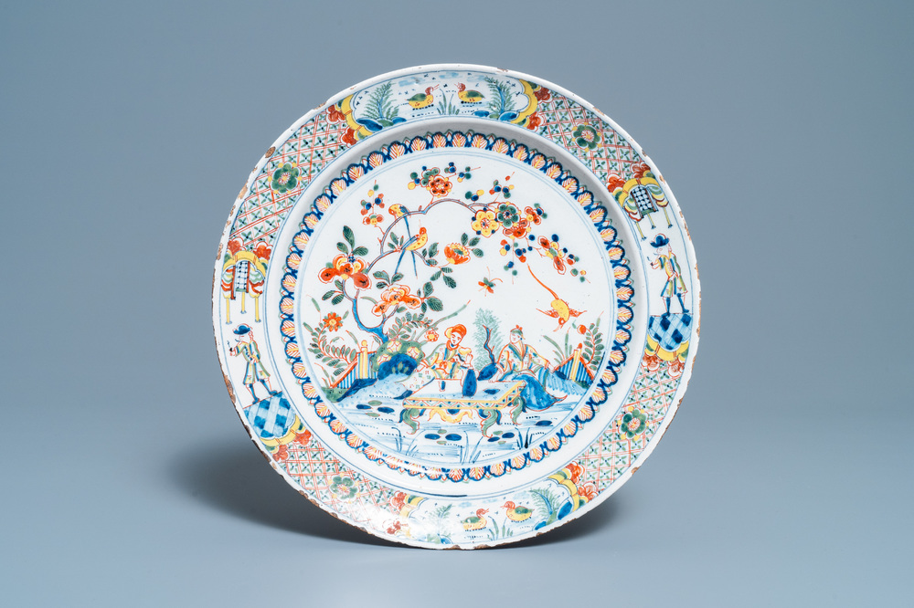 A polychrome English Delftware chinoiserie tea scene dish, 18th C.