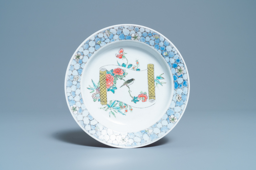 A Chinese famille rose 'ruby back' plate with a bird on a blossoming branch, Yongzheng