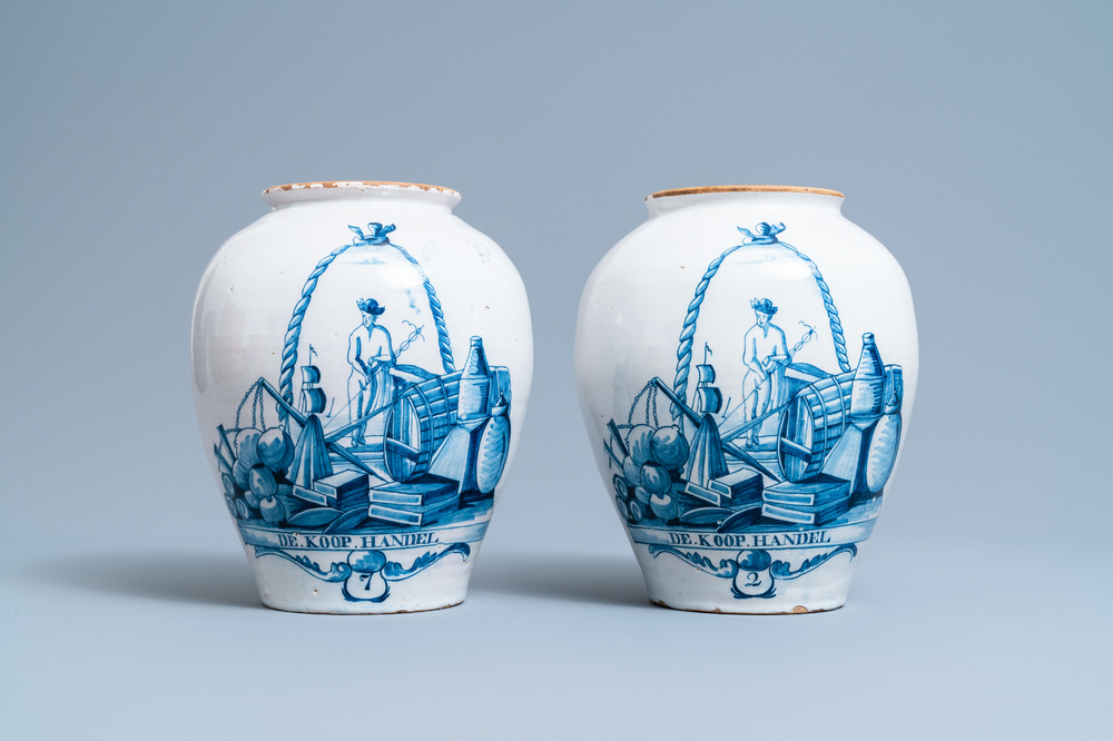 A pair of Dutch Delft blue and white tobacco jars with a trader, 18th C.