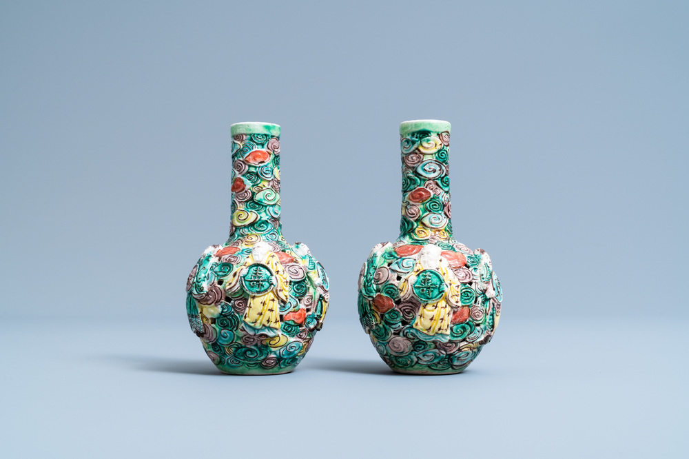 A pair of Chinese reticulated famille verte bottle vases, 19th C.