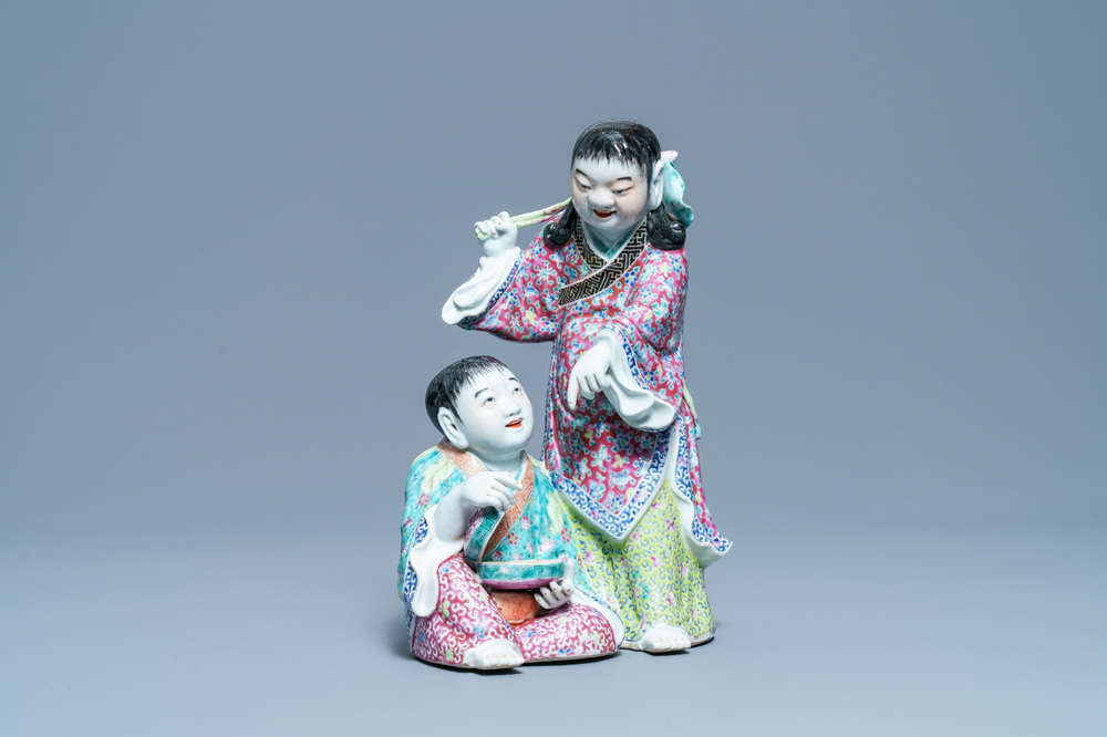 A Chinese famille rose group of two boys with a bat, seal mark, Republic