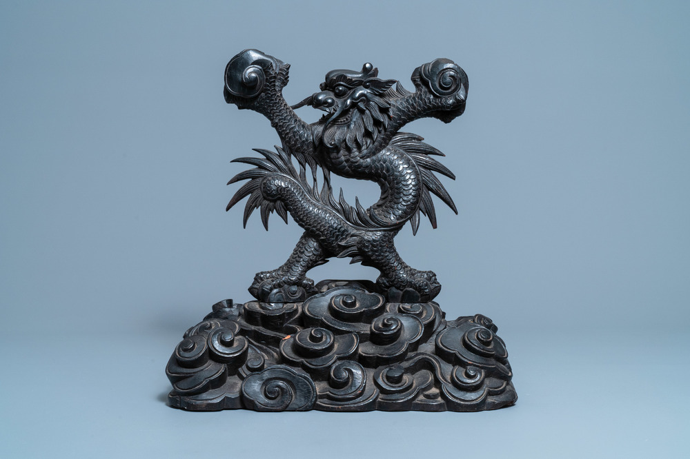 A large Chinese carved wooden 'dragon' stand for a dish or a mirror, 19th C.