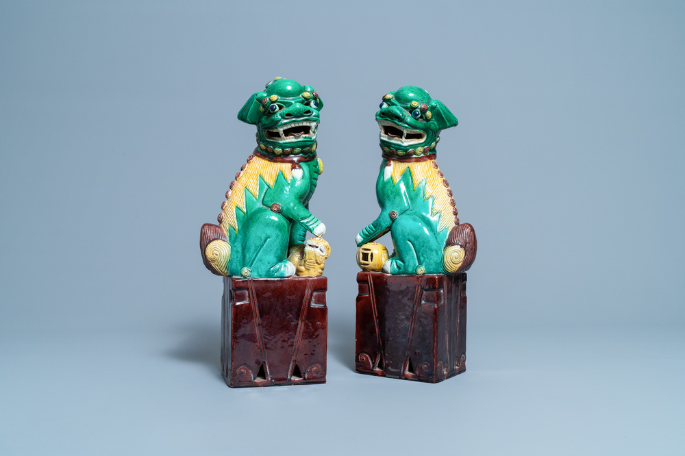 A pair of tall Chinese sancai-glazed biscuit models of Buddhist lions, 19/20th C.
