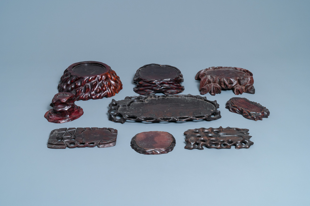 Nine Chinese naturalistically carved wooden stands, 19/20th C.
