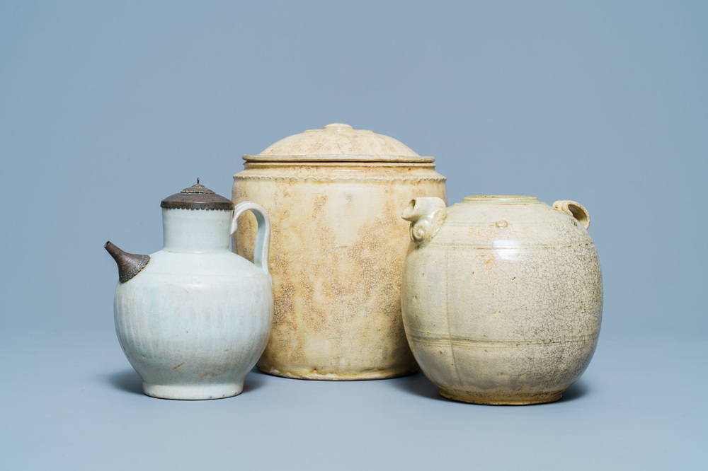 A Chinese celadon-glazed 'Jue' ewer, a qingbai-glazed wine ewer and a storage vessel, Song/Yuan