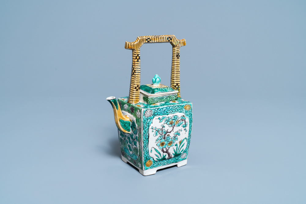 A Chinese verte biscuit teapot and cover, Kangxi