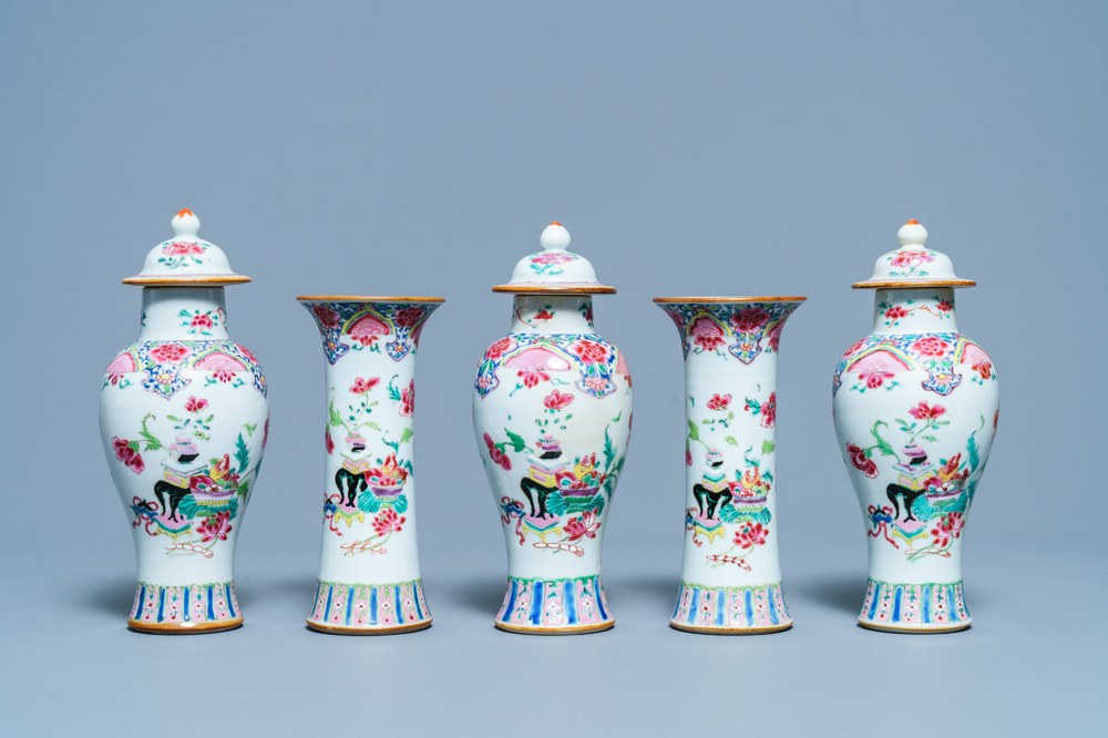 A Chinese famille rose garniture of five vases with antiquities, Qianlong