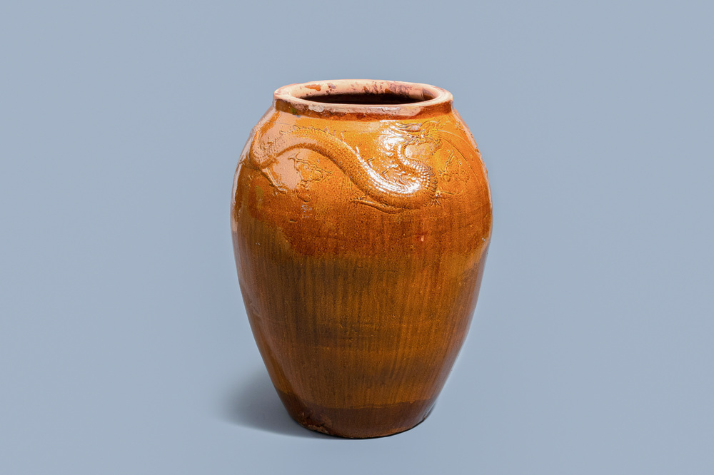A massive Chinese brown-glazed 'dragon and phoenix' martaban jar, Qing