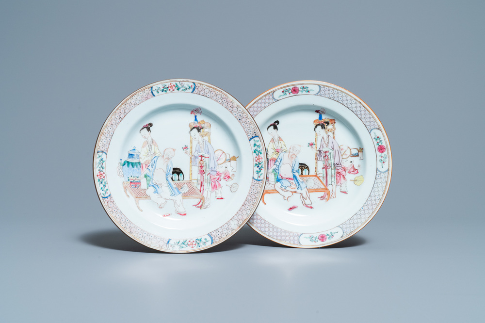 A pair of fine Chinese famille rose ruby back plates with figures in an interior, Yongzheng