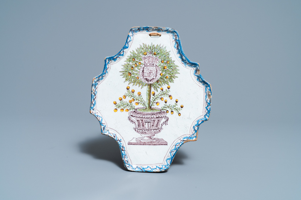 A polychrome Dutch Delft 'Orange tree' plaque, 18th C.