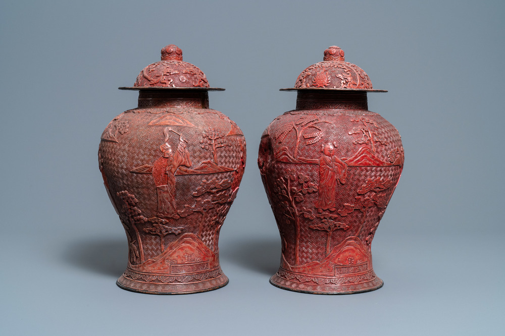 A pair of Chinese red cinnabar lacquer vases and covers, Zhengde mark, Qing