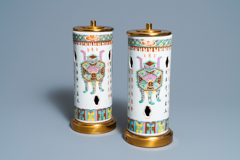 A pair of Chinese reticulated famille rose hat stands mounted as lamps, 19th C.