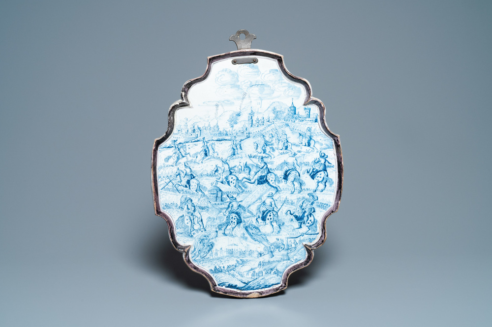 A large Dutch Delft blue and white 'cavalry' plaque, 18th C.