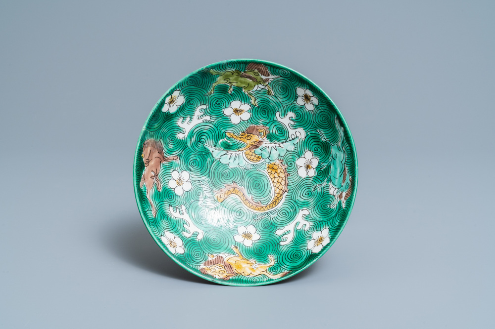 A shallow Chinese verte biscuit 'mythical beast' bowl, Jiajing mark, Kangxi