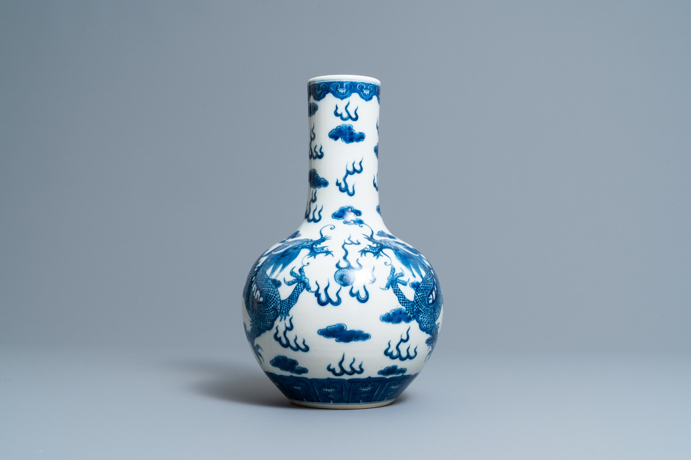 A Chinese blue and white 'dragons' bottle vase, Yongzheng mark, 19th C.