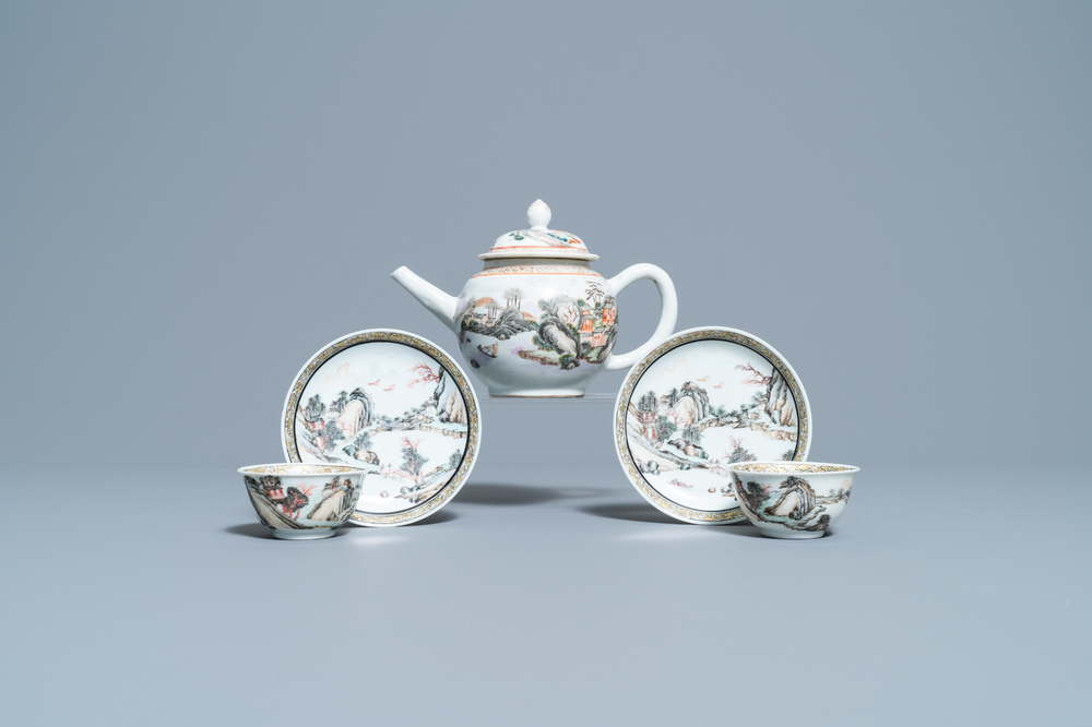 A fine Chinese 'landscape' teapot and a pair of cups and saucers, Yongzheng