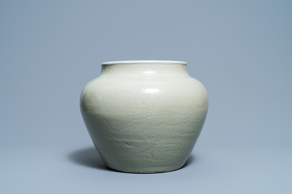 A globular Chinese monochrome celadon 'dragon' vase, Kangxi