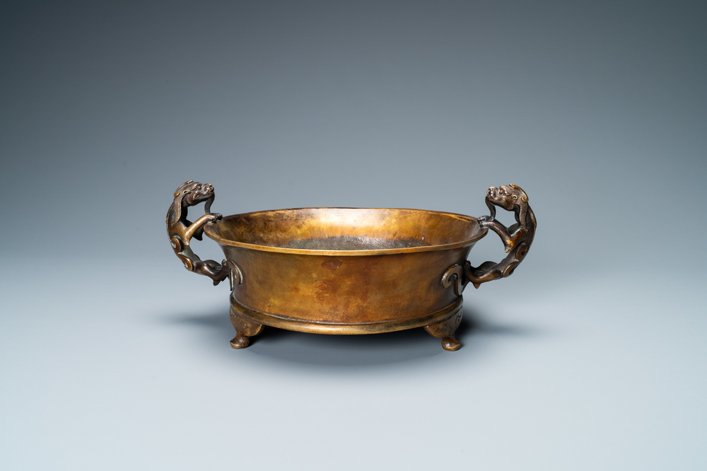 A large Chinese bronze tripod censer with chilong handles, Xuande mark, 18/19th C.