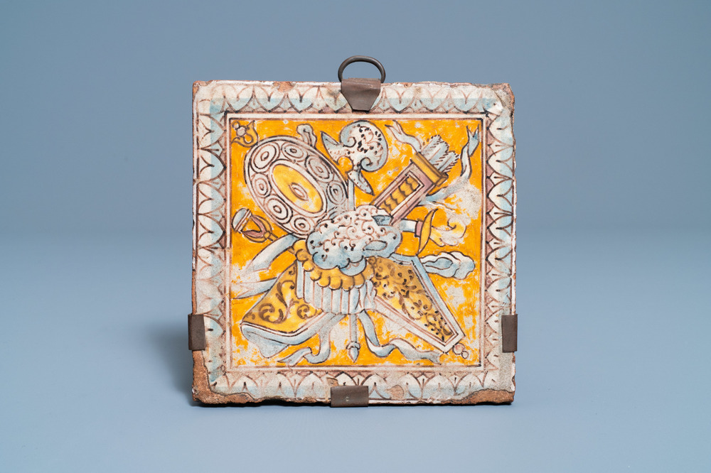 A maiolica floor tile with weapons and armoury, Italy or France, 16/17th C.