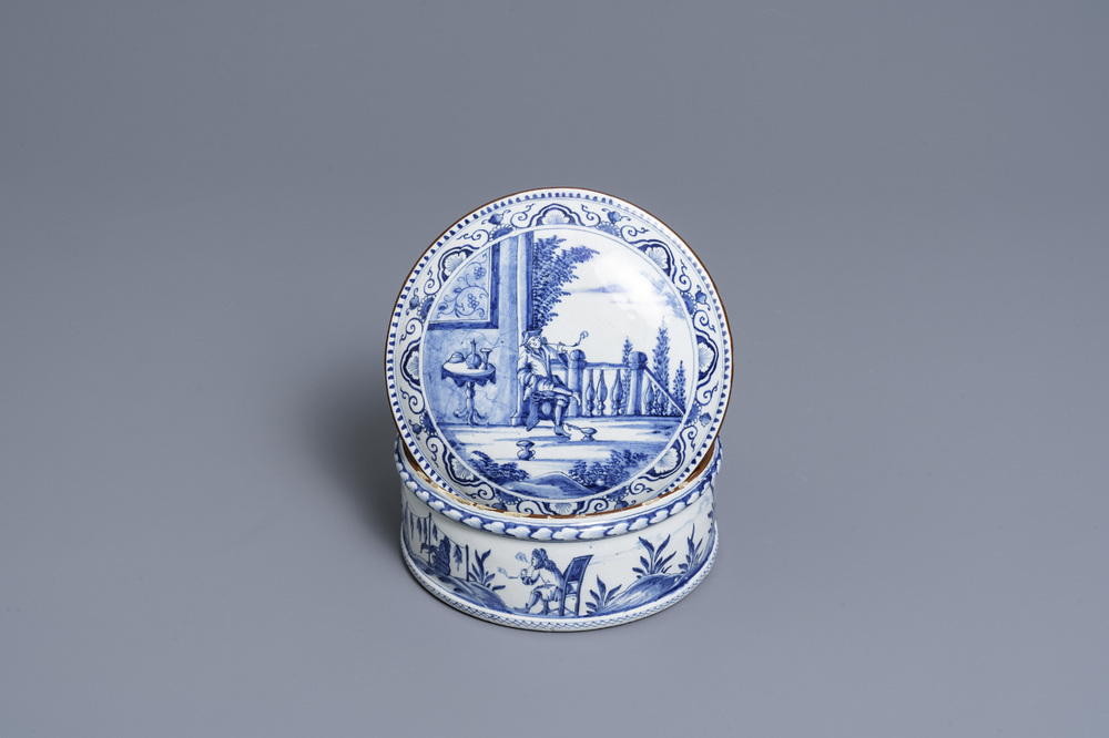 A round Dutch Delft blue and white box and cover with tobacco harvesting scenes, 18th C.