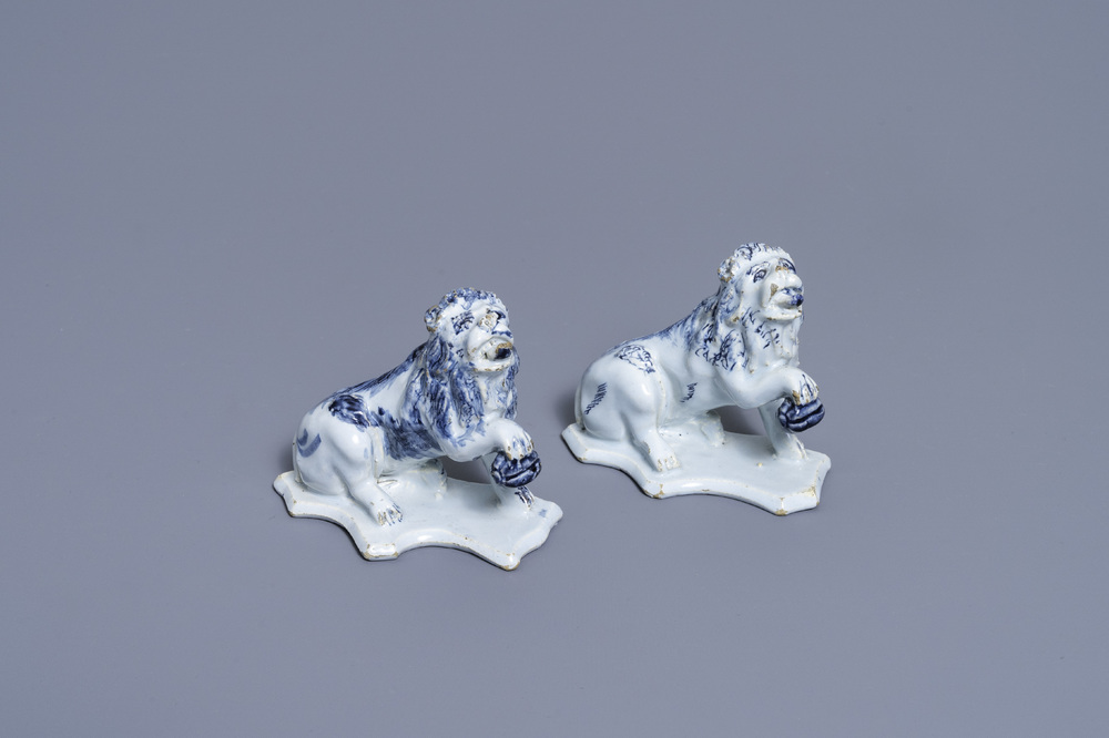 A pair of Dutch Delft blue and white models of lions, 18th C.