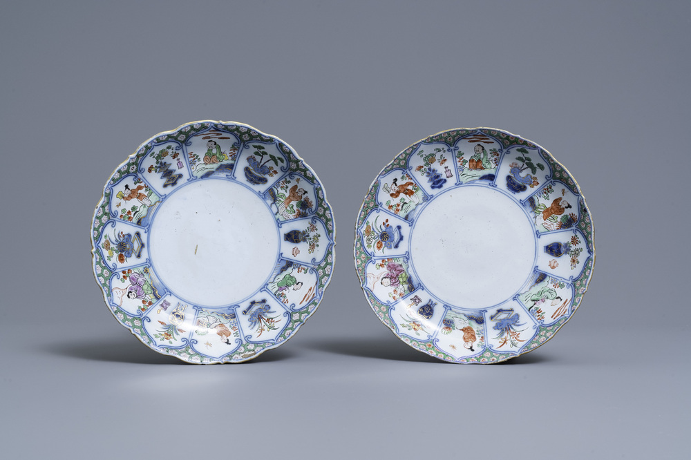 A pair of polychrome petit feu and gilded Dutch Delft famille verte-style chinoiserie plates, 1st quarter 18th C.
