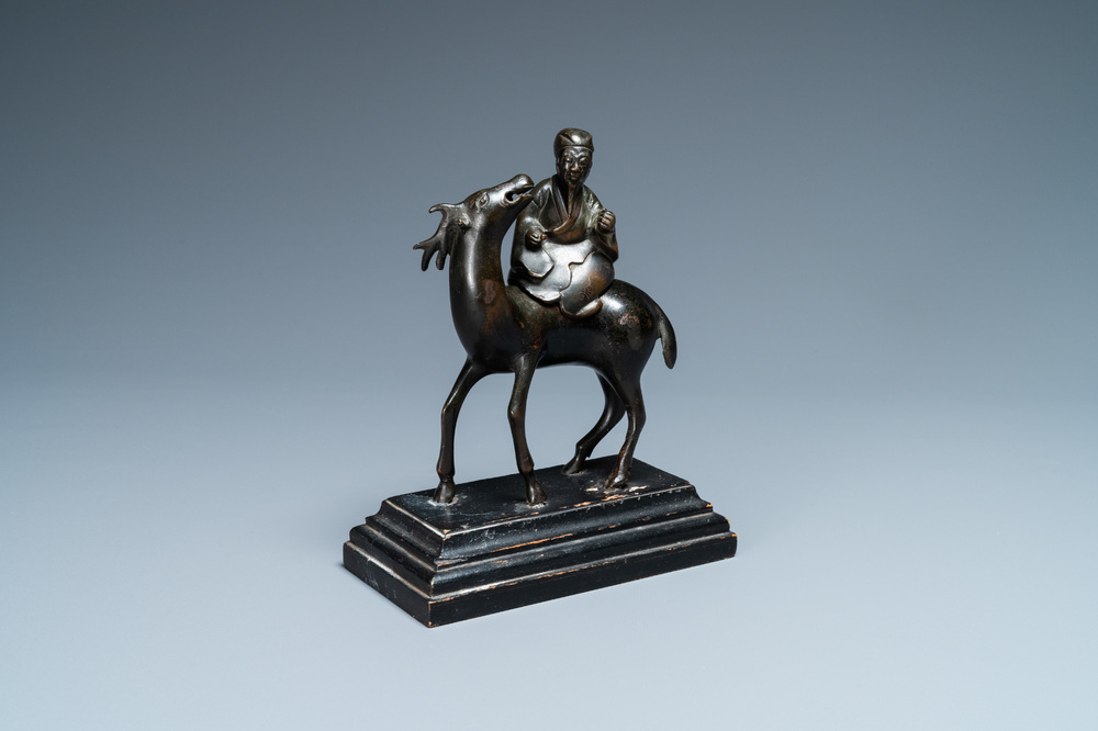 A Chinese bronze censer depicting a scholar on a deer, early Qing