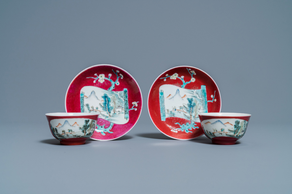 A pair of Chinese famille rose ruby-ground cups and saucers, Yongzheng