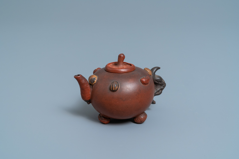A Chinese Yixing stoneware teapot and cover with applied nuts, 19/20th C.