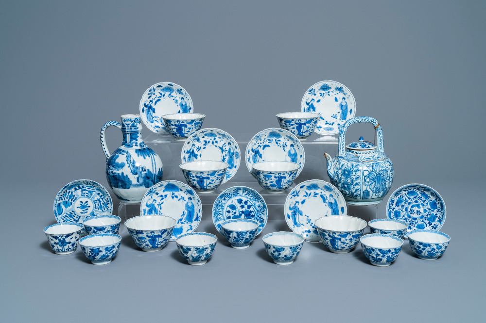 A collection of Chinese and Japanese blue and white cups and saucers and two ewers, Wanli and later