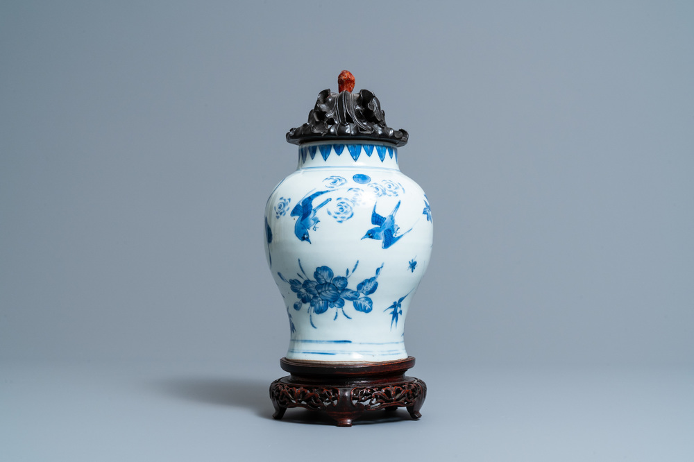 A Chinese blue and white vase with birds among blossoms, Transitional period