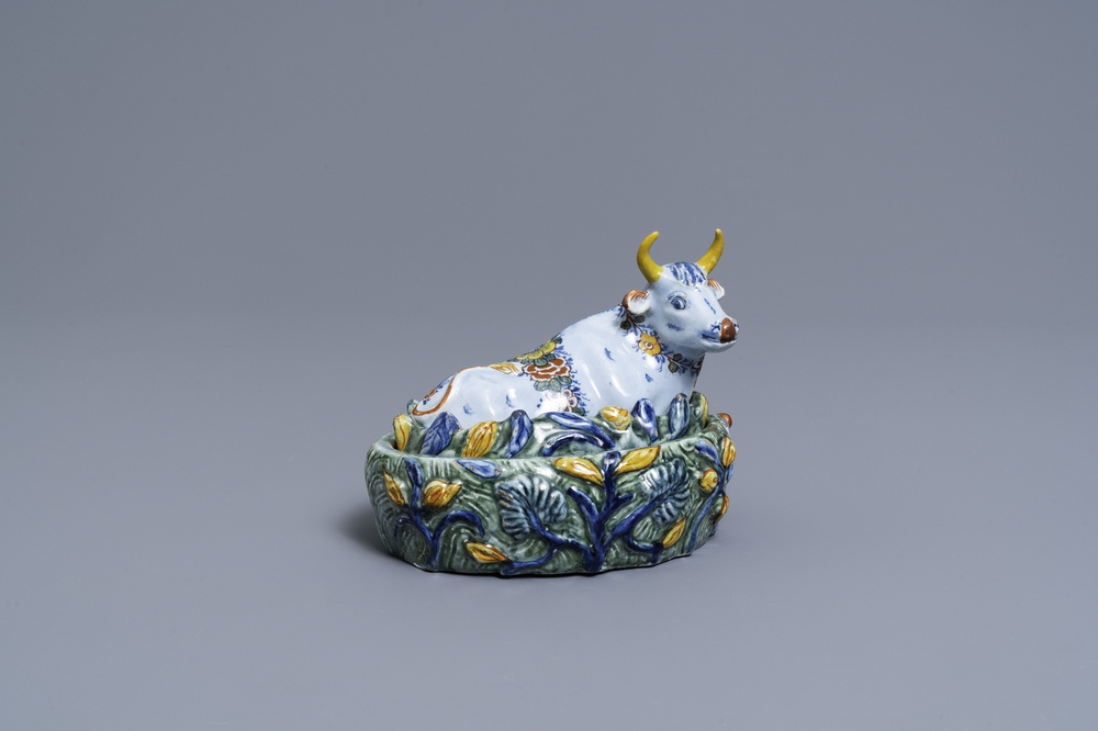 A polychrome Dutch Delft butter tub in the shape of a cow, 18th C.