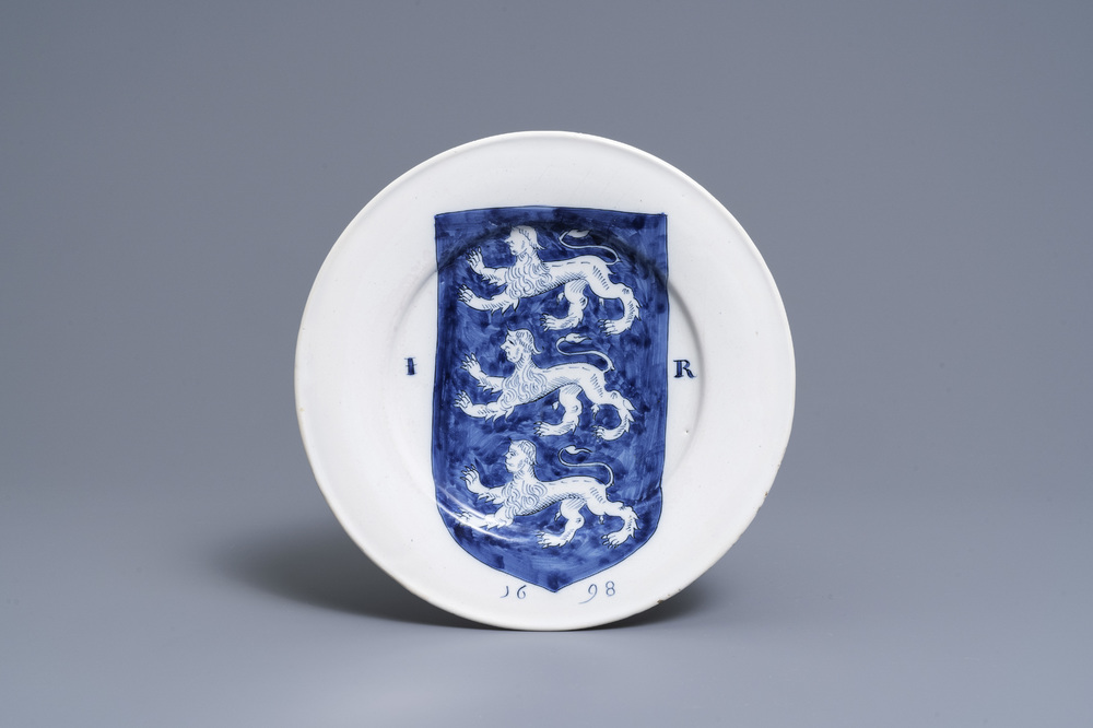 A Dutch Delft blue and white dish with the arms of James I, dated 1698