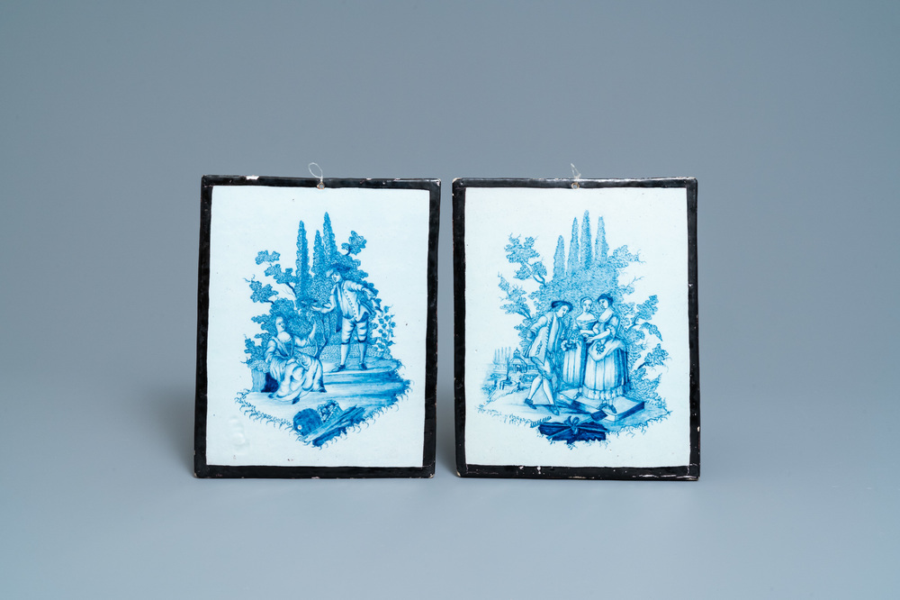 A pair of Dutch Delft blue and white plaques with black borders, 18th C.