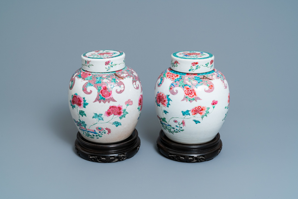 A pair of Chinese famille rose jars and covers with floral design, Qianlong