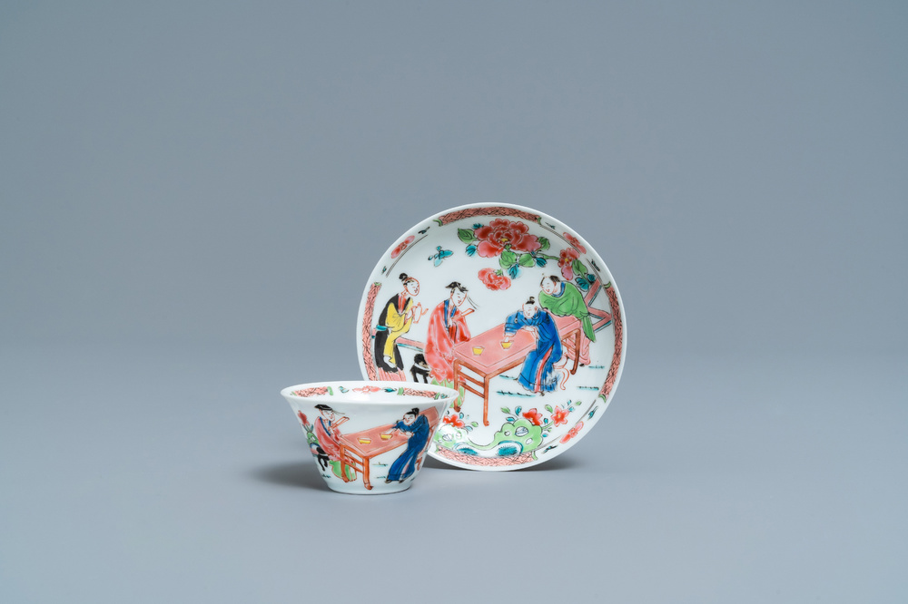 A Chinese famille rose 'tea scene' cup and saucer, Yongzheng/Qianlong