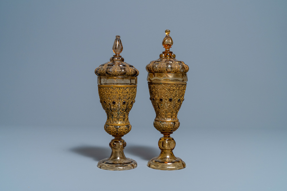 A pair of Russian or Eastern-European gilt copper and glass-inlaid glass goblets and covers, 19th C.