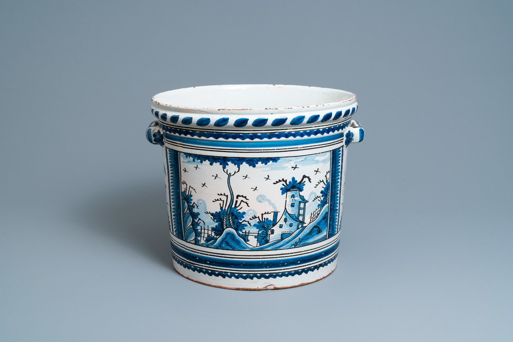 A large blue, white and manganese 'landscape' jardini&egrave;re, Nevers, France, 18th C.