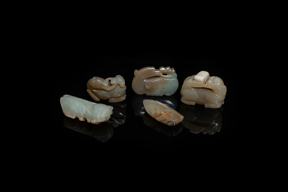 Five Chinese celadon and russet jade carvings, 19th C.