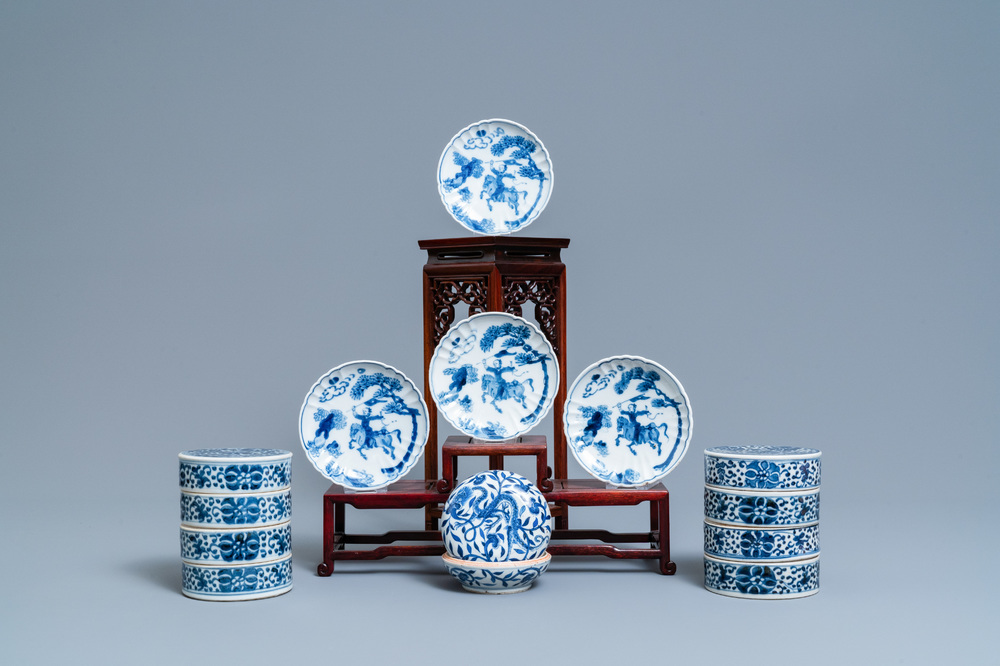 A pair of Chinese blue and white three-tier stacking boxes, a seal paste box and four saucers, 19th C.