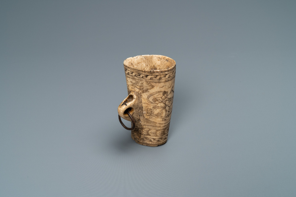 The central part of a stag horn powder flask with engraved design of 'Diana hunting deer', 17th C.