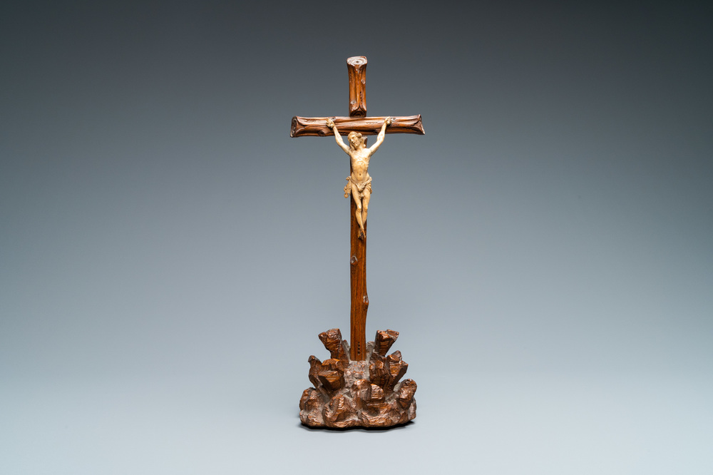 An ivory Corpus Christi on naturalistically carved wooden crucifix, probably France, 17/18th C.