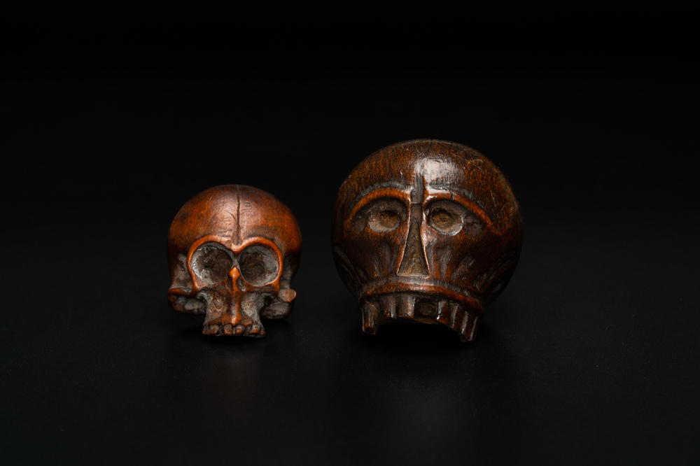 Two wooden memento mori skulls, 17/18th C.