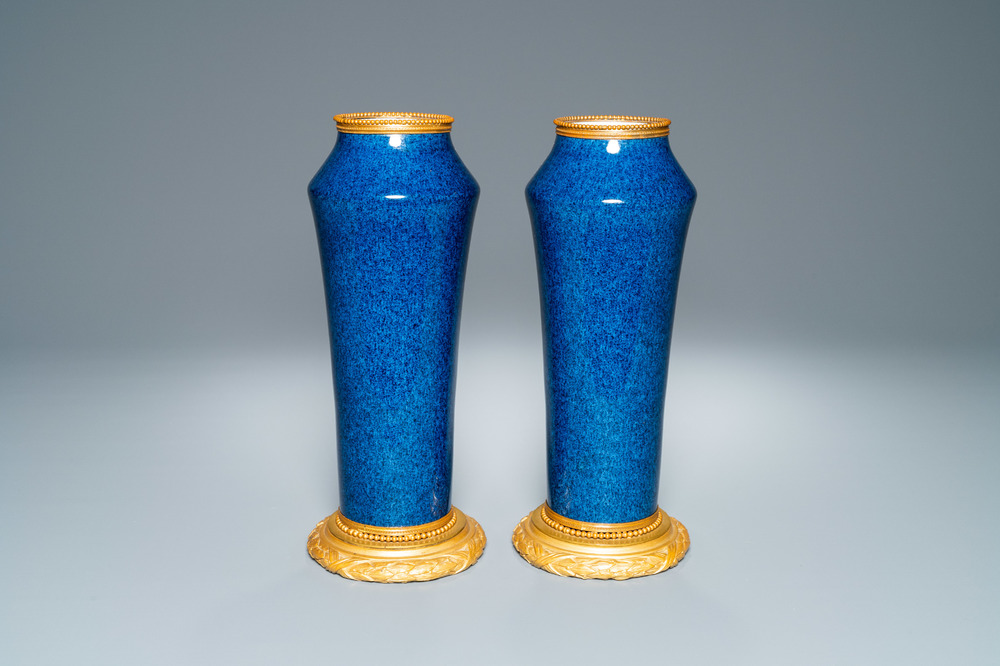 A pair of monochome powder blue S&egrave;vres vases with gilded bronze mounts, 19th C.