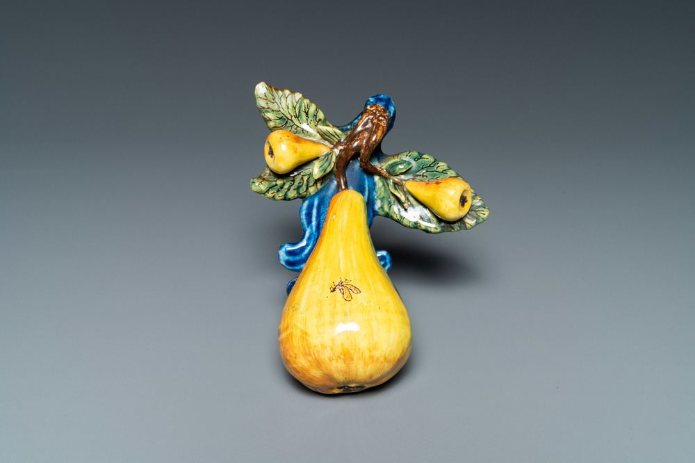 A polychrome Dutch Delft group of three pears, 18th C.